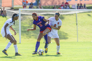 Syracuse struggles for a ball against Clemson. The Orange have lost five-straight games.